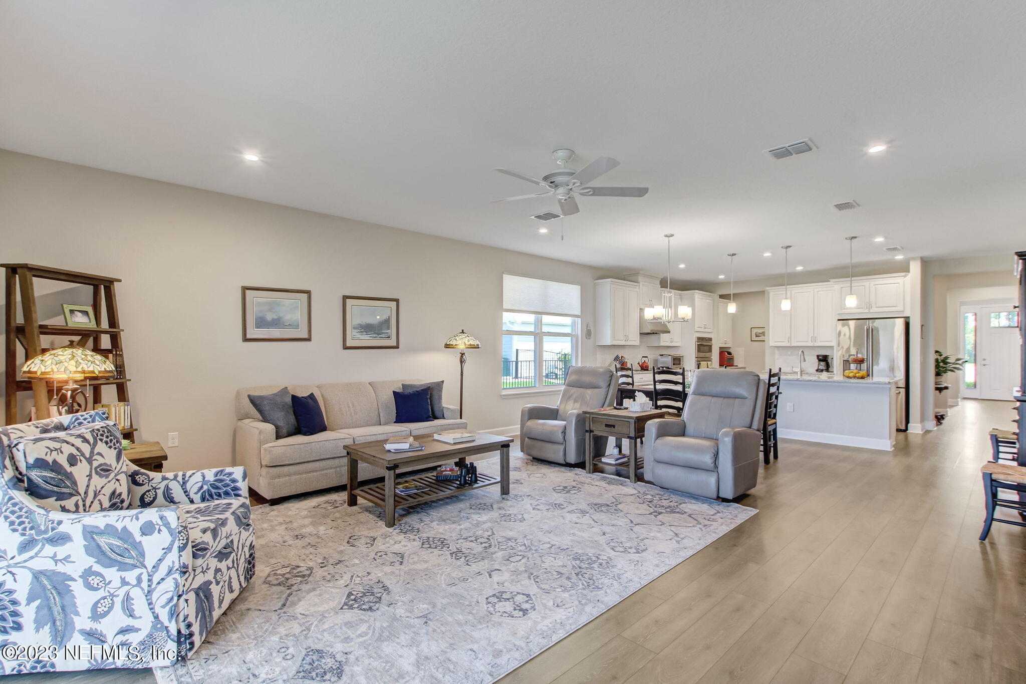 85276 Berryessa Way Yulee, FL 32097 - Photo 11 of 42 a living room with furniture and wooden floor