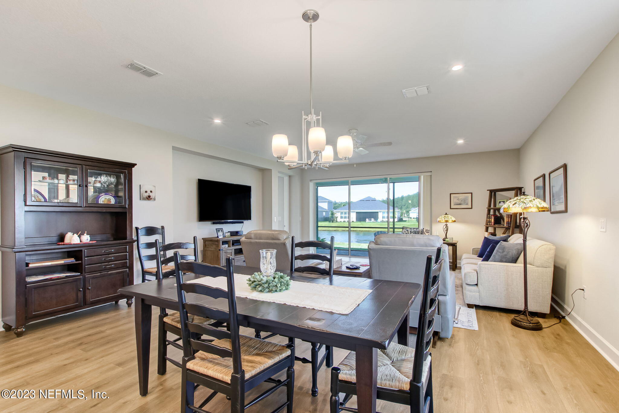 85276 Berryessa Way Yulee, FL 32097 - Photo 13 of 42 a view of a dining room with furniture window and wooden floor