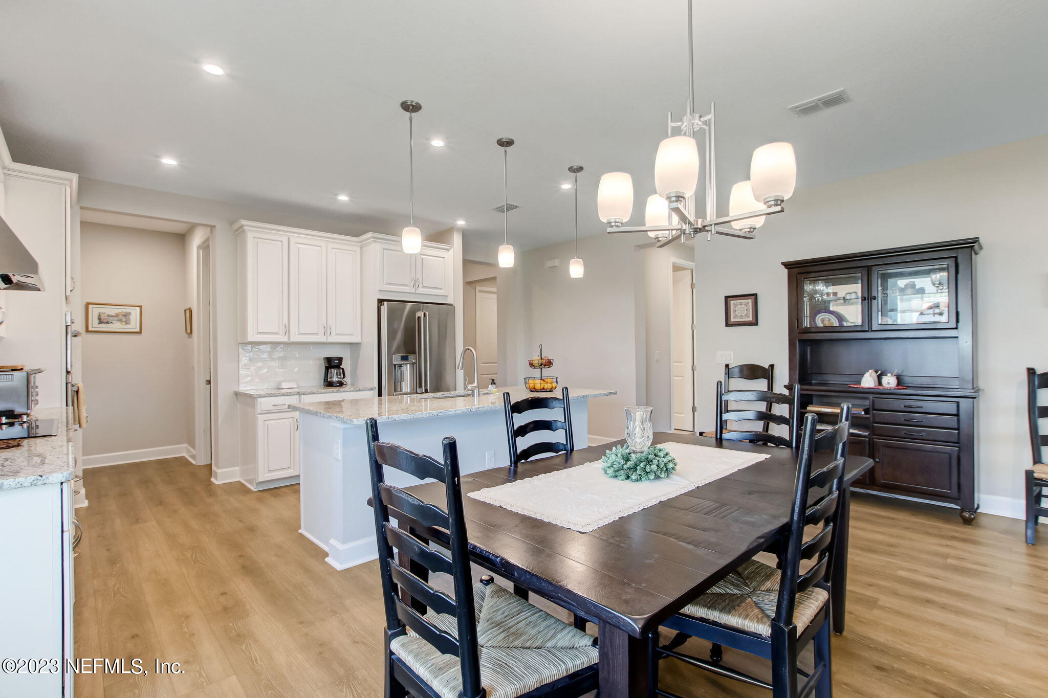 85276 Berryessa Way Yulee, FL 32097 - Photo 14 of 42 a view of a dining room and kitchen with a table chairs