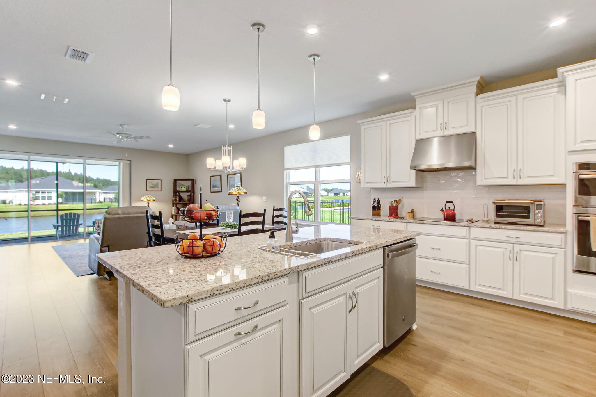 85276 Berryessa Way Yulee, FL 32097 - Photo 18 of 42 a kitchen with a sink window and cabinets