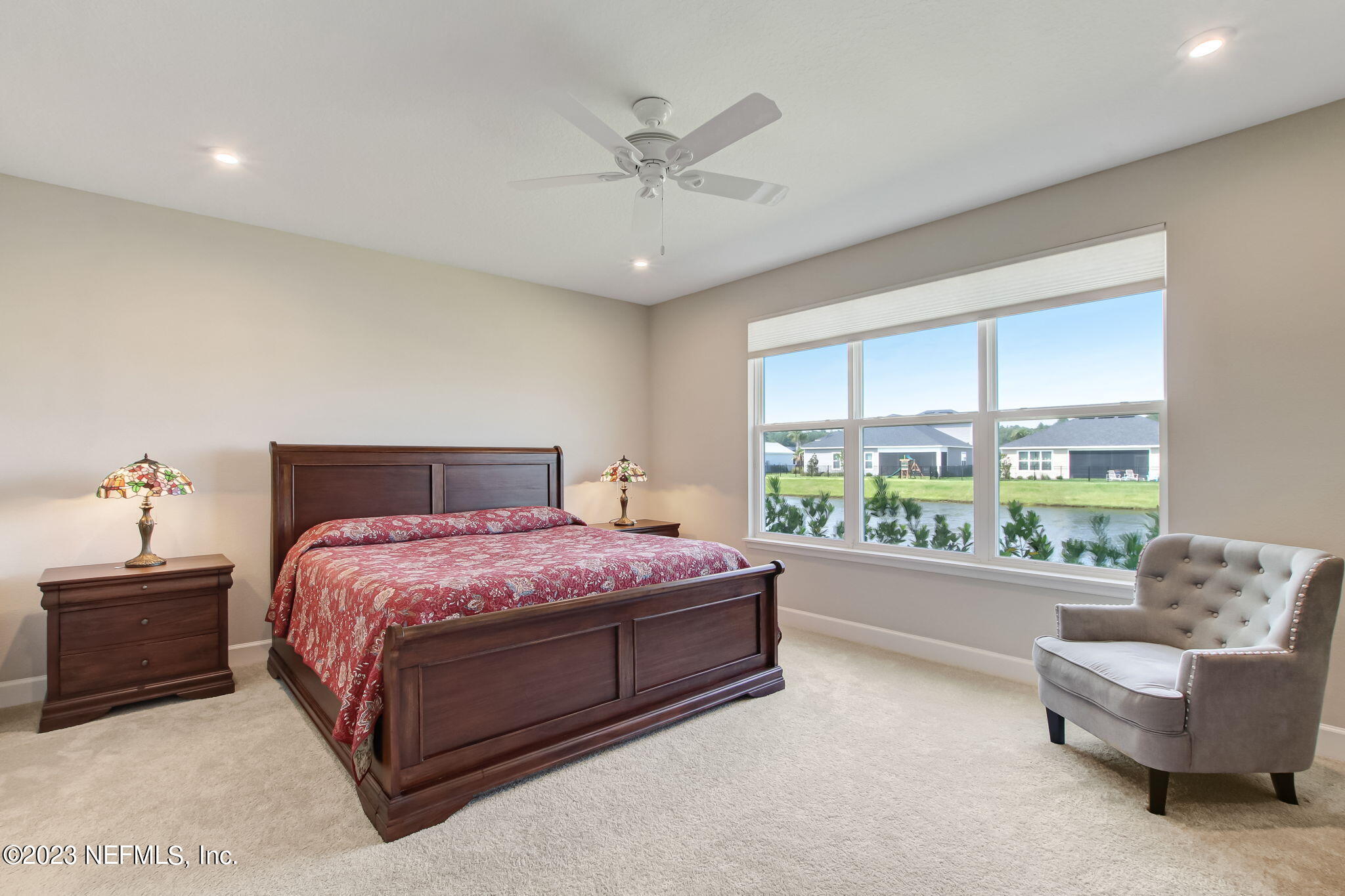 85276 Berryessa Way Yulee, FL 32097 - Photo 21 of 42 a spacious bedroom with a bed and a couch