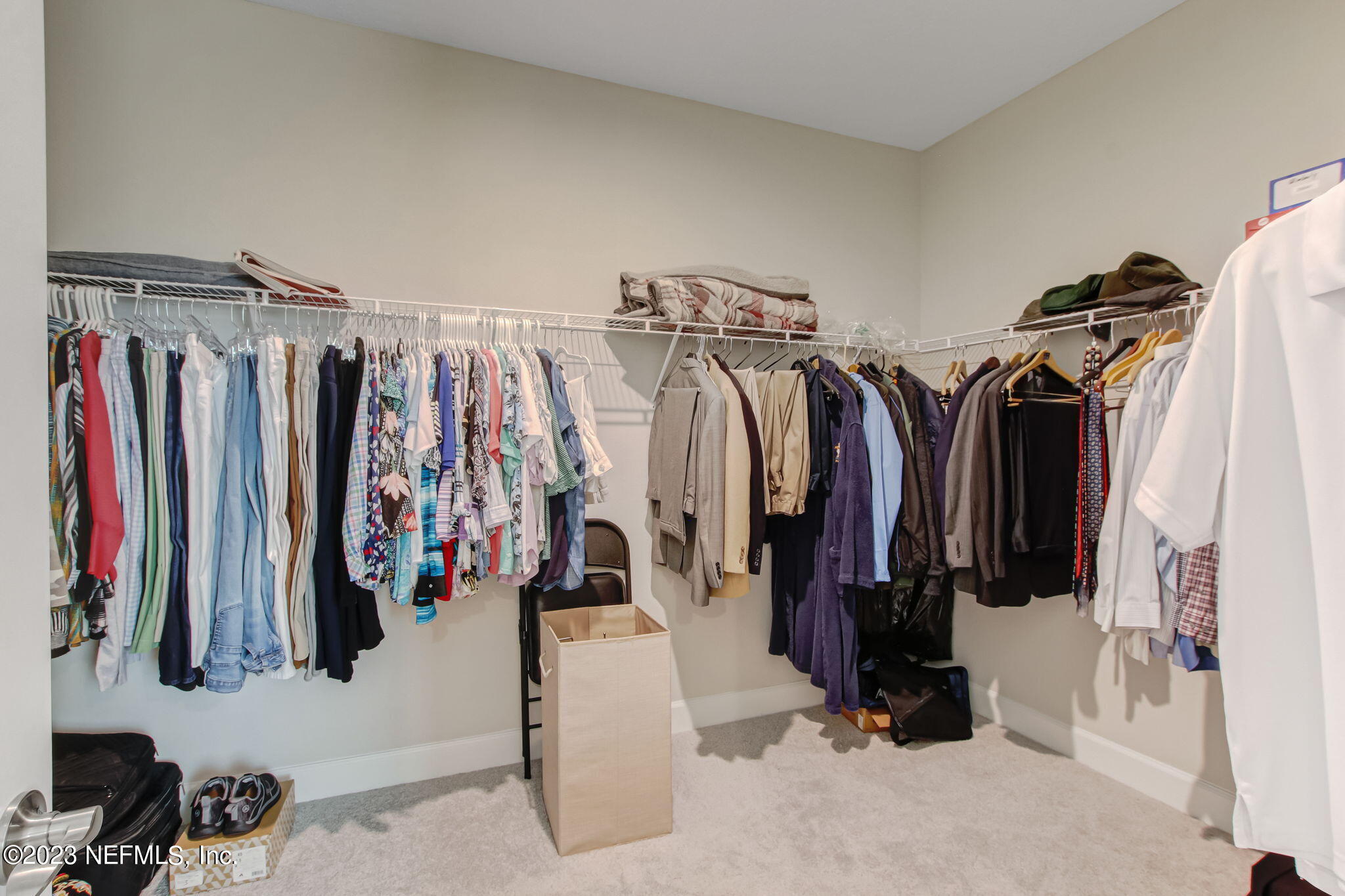 85276 Berryessa Way Yulee, FL 32097 - Photo 22 of 42 a view of walk in closet with clothes