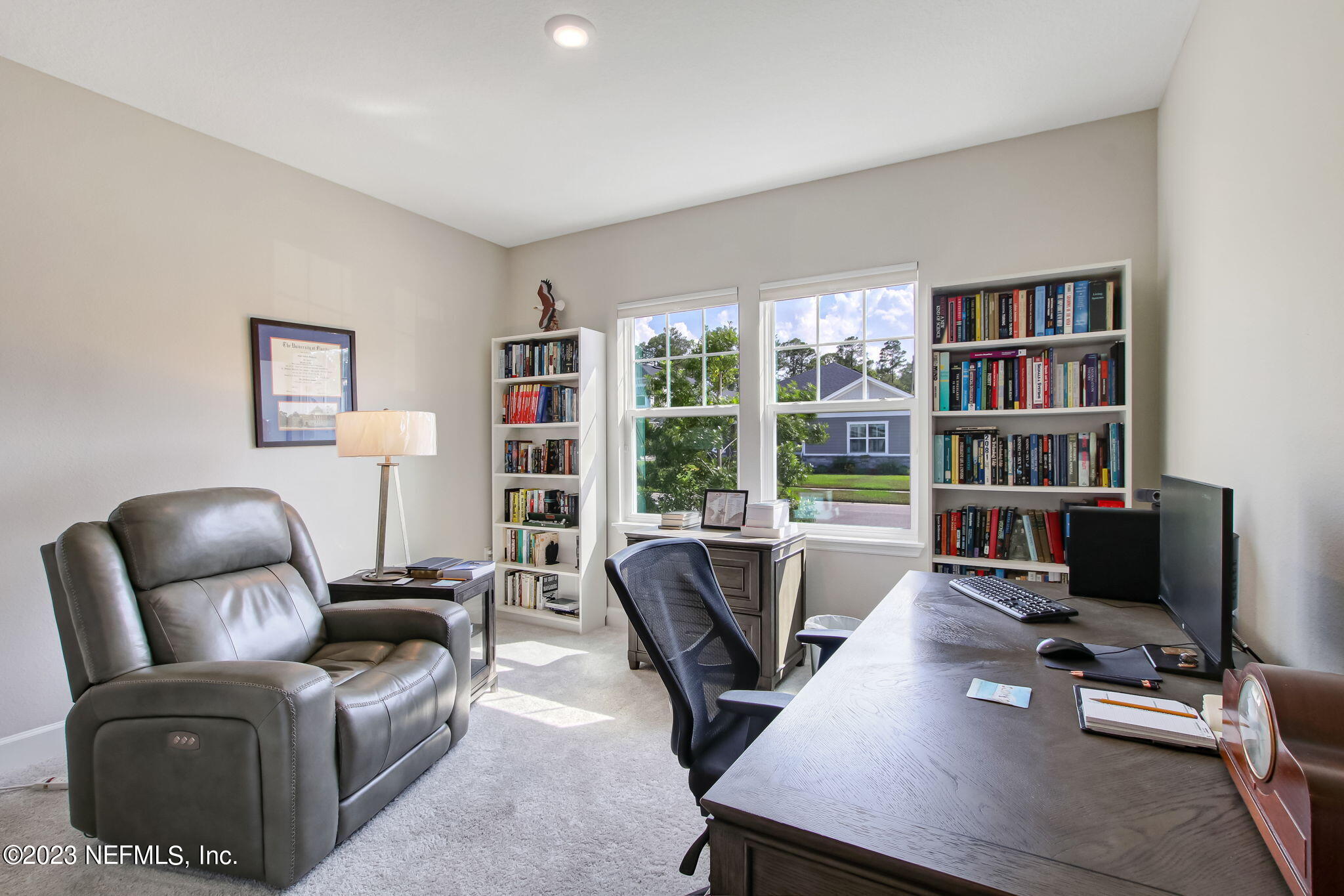 85276 Berryessa Way Yulee, FL 32097 - Photo 25 of 42 a work room with furniture and a floor to ceiling window