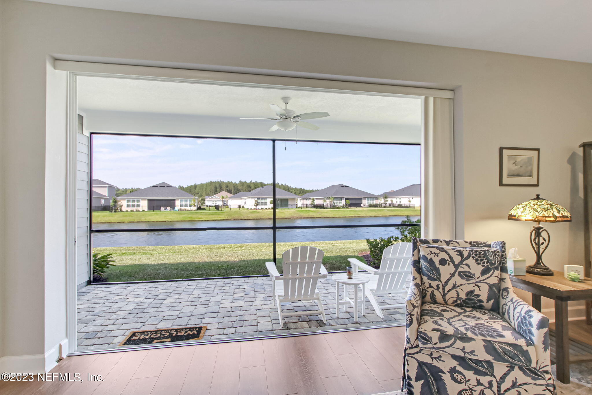 85276 Berryessa Way Yulee, FL 32097 - Photo 31 of 42 a view of a living room and floor to ceiling window