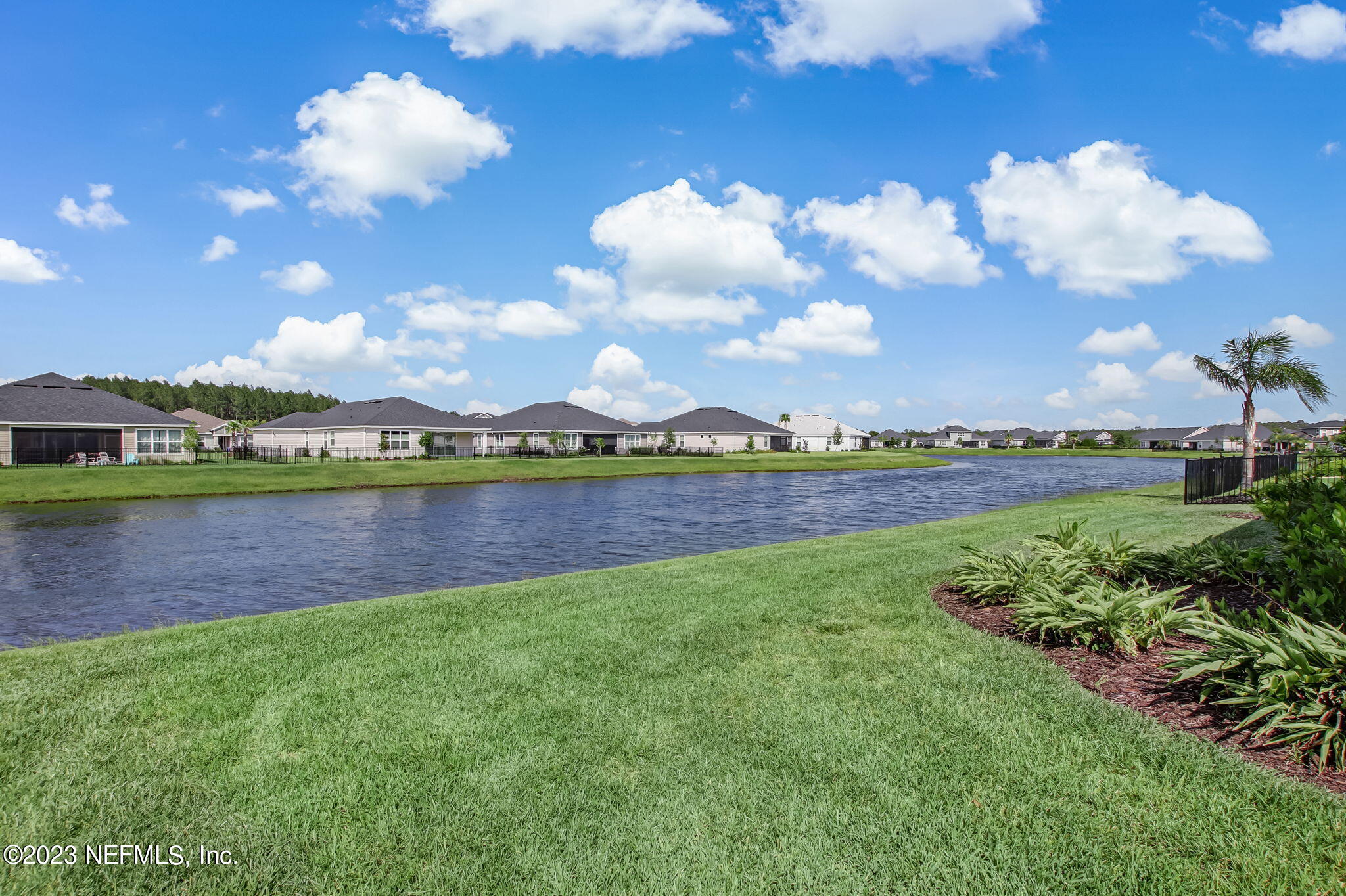 85276 Berryessa Way Yulee, FL 32097 - Photo 33 of 42 a view of a lake with houses in back