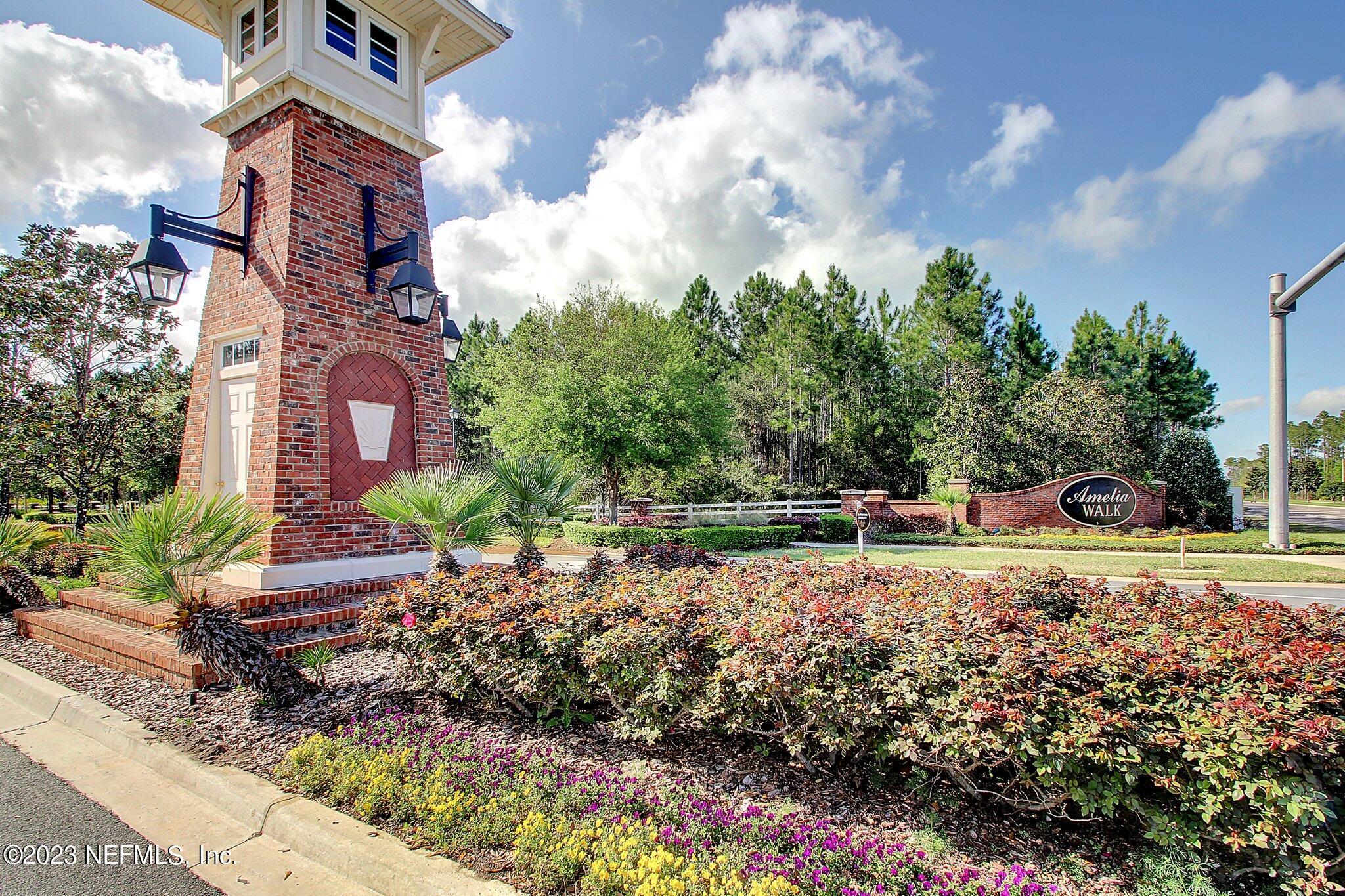 85276 Berryessa Way Yulee, FL 32097 - Photo 35 of 42 a backyard of a house with lots of green space and lake view