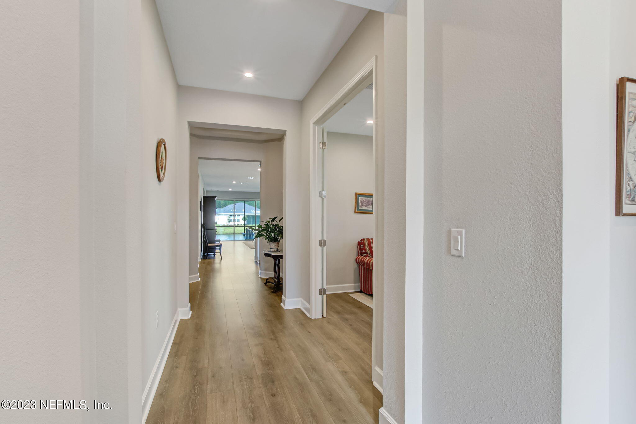 85276 Berryessa Way Yulee, FL 32097 - Photo 4 of 42 a view of a hallway with wooden floor