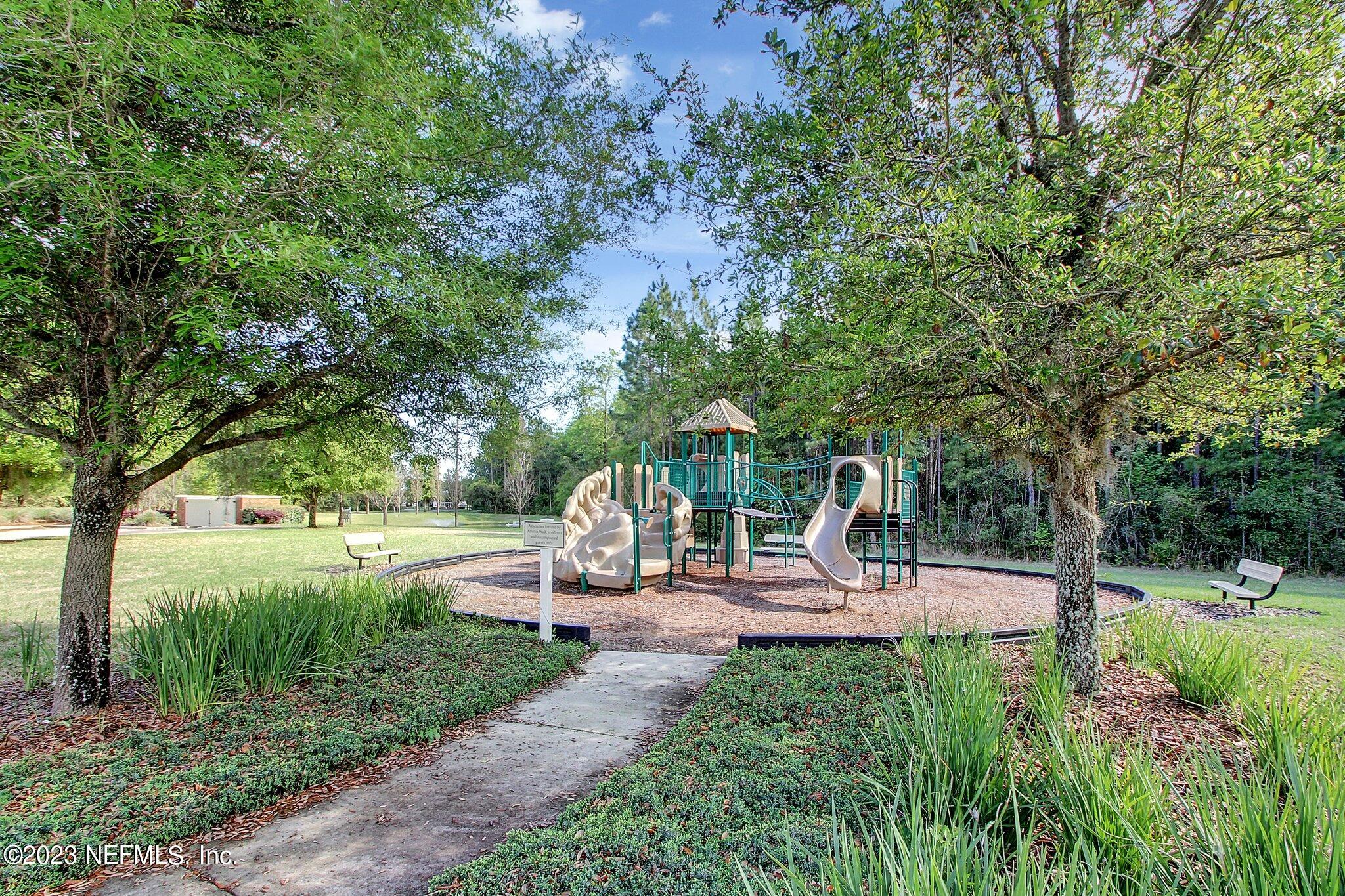 85276 Berryessa Way Yulee, FL 32097 - Photo 41 of 42 a view of outdoor space with garden and trees