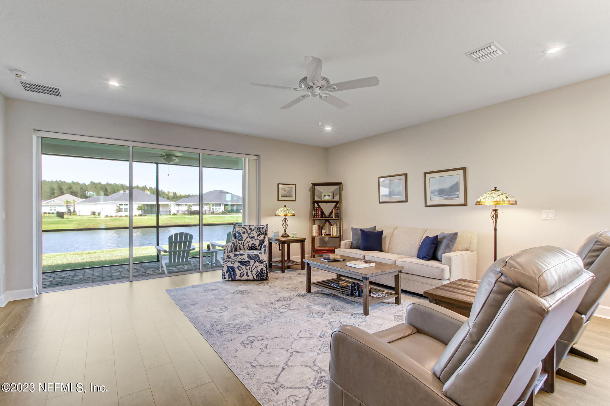 85276 Berryessa Way Yulee, FL 32097 - Photo 9 of 42 a living room with furniture and a large window with balcony view