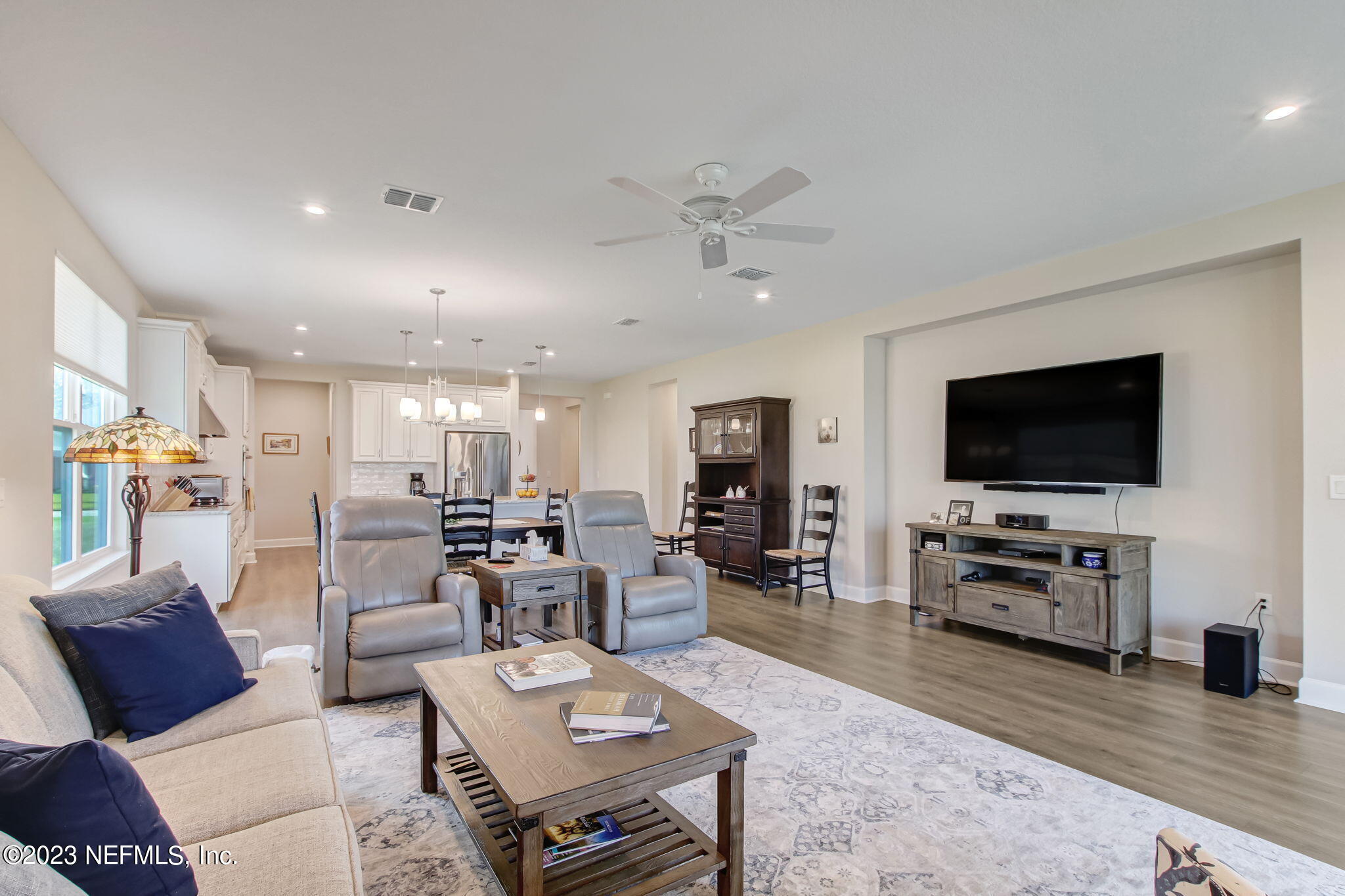 85276 Berryessa Way Yulee, FL 32097 - Photo 10 of 42 a living room with furniture and a flat screen tv