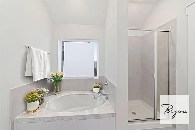 a bathroom with a tub and a sink