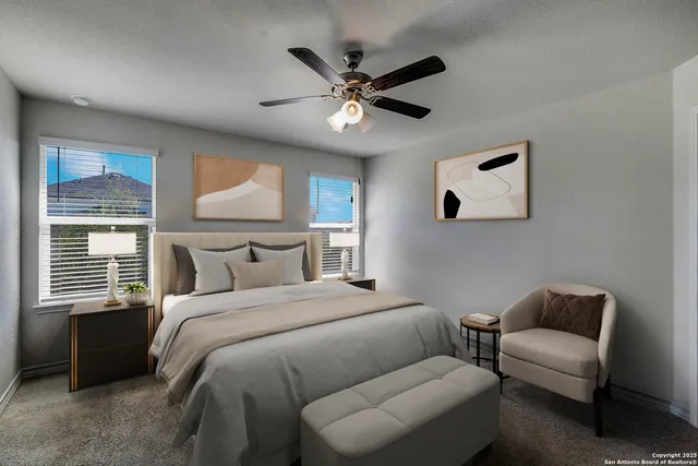 a bedroom with a bed couch and window