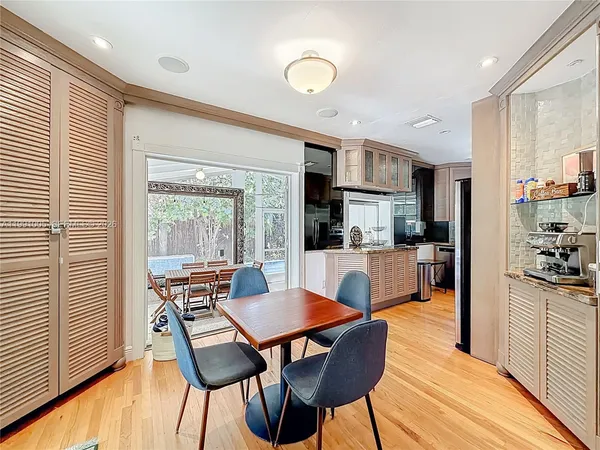 a kitchen with stainless steel appliances granite countertop a sink dishwasher stove and refrigerator
