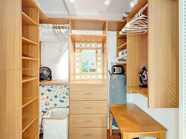 a view of hallway with wooden floor