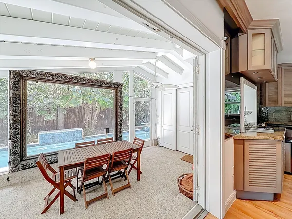 a dining room with furniture and window