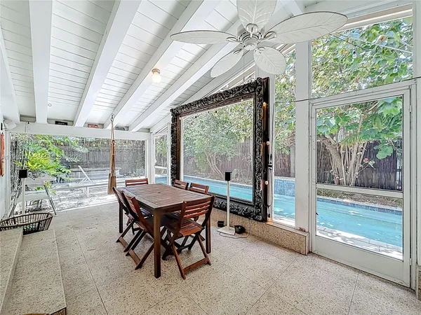 a dining room with furniture and window