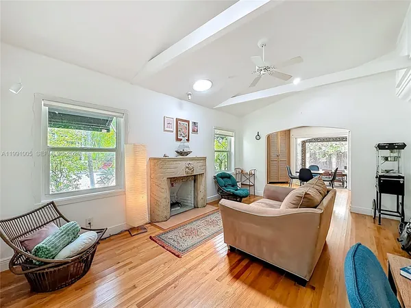 a living room with furniture and a fireplace