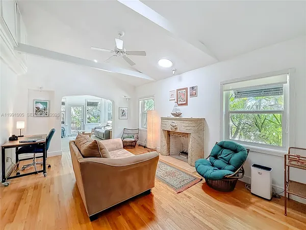 a living room with furniture and a fireplace