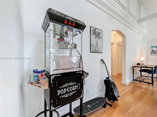 a kitchen with stainless steel appliances kitchen island granite countertop a sink and cabinets