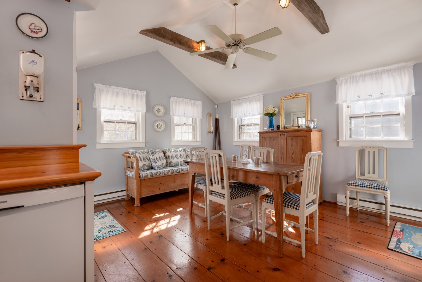 42 North Liberty Street Nantucket, MA 02554 - Photo 12 of 20 a dining room with furniture a window and wooden floor