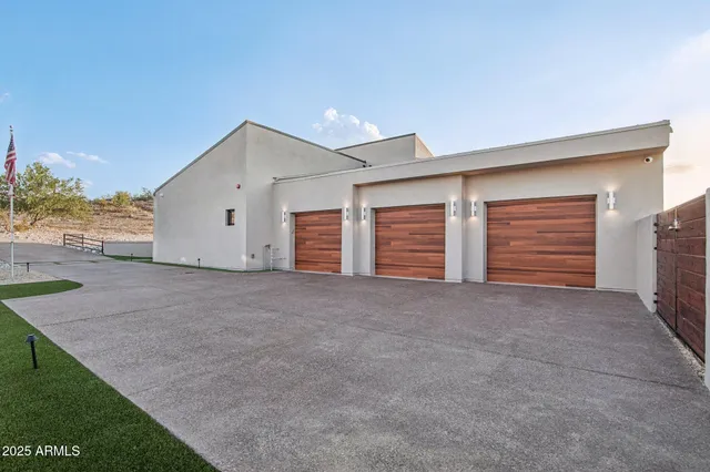 a view of an empty room with yard and garage