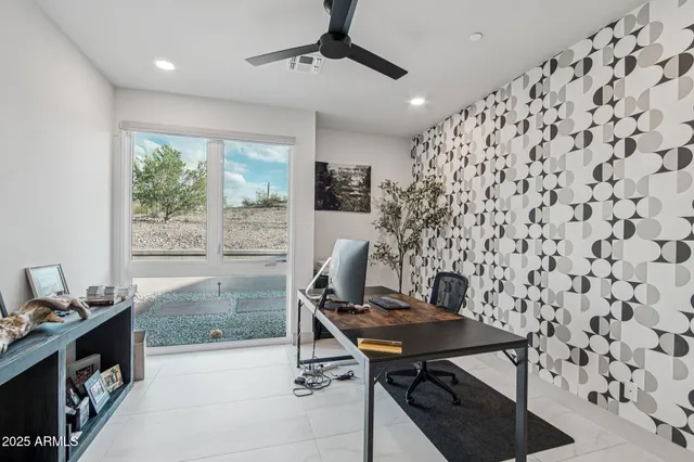 a workspace with furniture and window