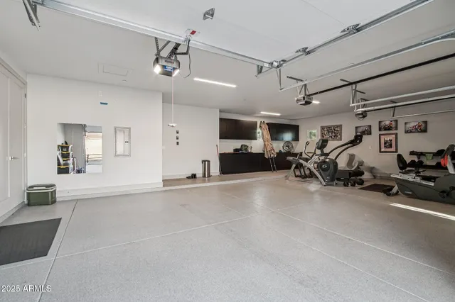 a view of a patio with a table chairs and a swimming pool