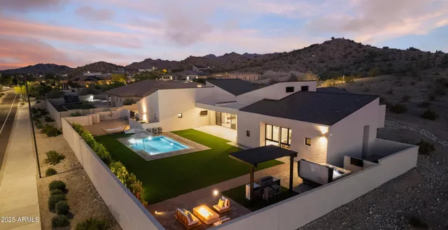 an aerial view of a house with a big yard