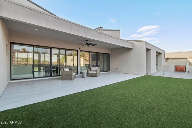 a view of an house with backyard porch and furniture