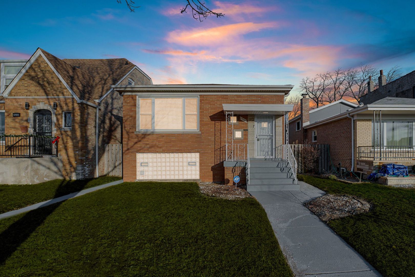 9209 South State Street Chicago, IL 60619 - Photo 20 of 20 a front view of a house with a yard