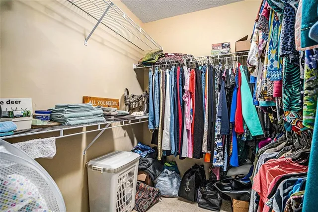 a view of a closet with storage