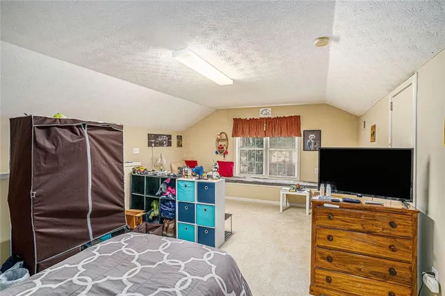 a room with furniture and a flat screen tv