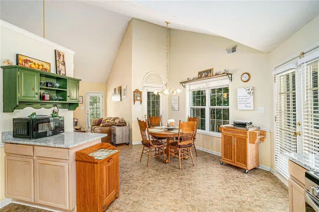 a living room with fireplace furniture and a flat screen tv