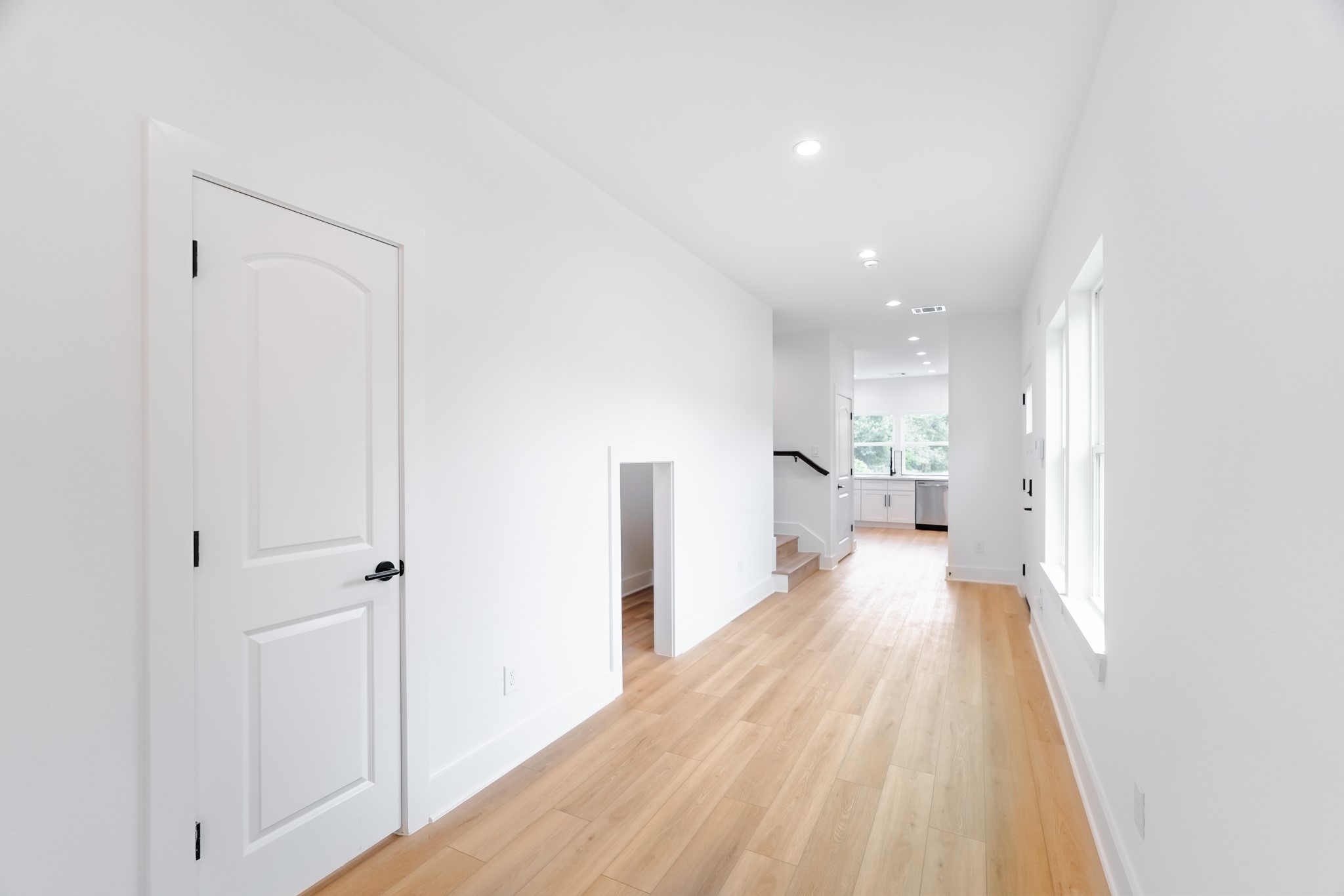 7903 Sunnyhill Street Houston, TX 77088 - Photo 15 of 33 a view of a living room with wooden floor