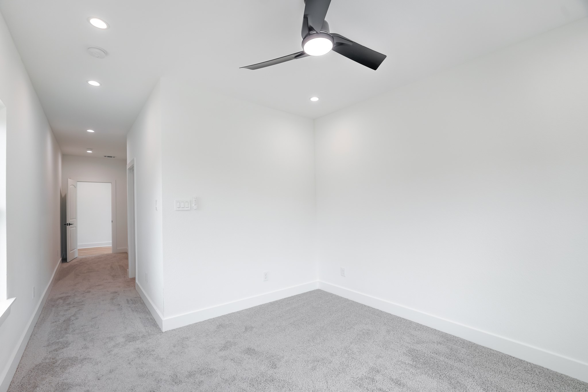 7903 Sunnyhill Street Houston, TX 77088 - Photo 23 of 33 an empty room with a empty space and a ceiling fan