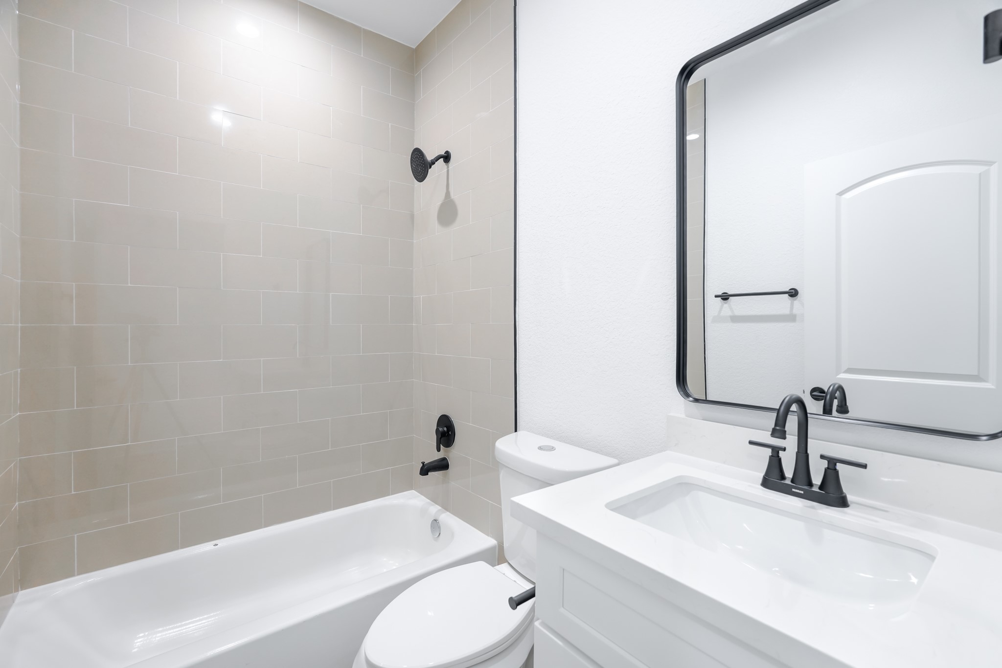 7903 Sunnyhill Street Houston, TX 77088 - Photo 28 of 33 a bathroom with a sink a toilet and shower