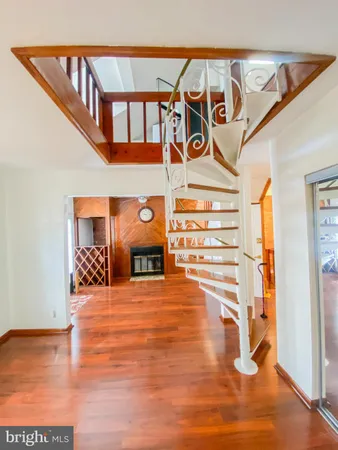 a view of a room with wooden floor