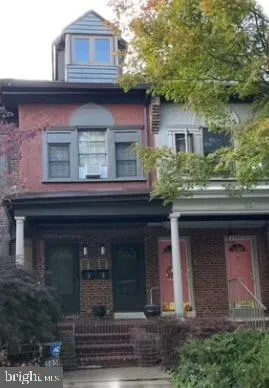 a wooden bench sitting in the middle of a building