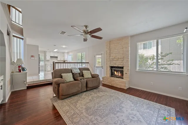 a living room with furniture and a fireplace