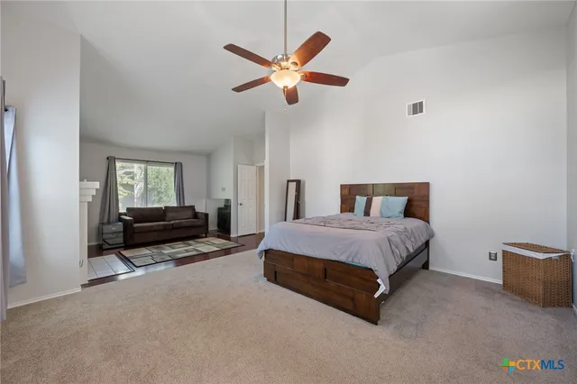 a bedroom with a bed and window