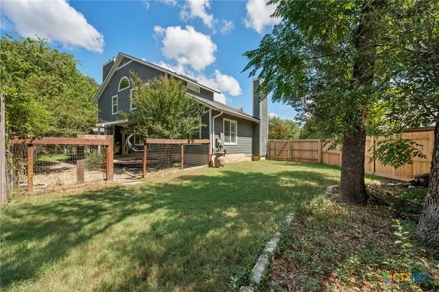 a view of backyard of a house