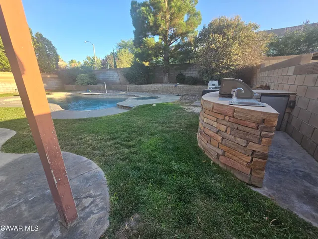 a view of a couches in backyard of the house