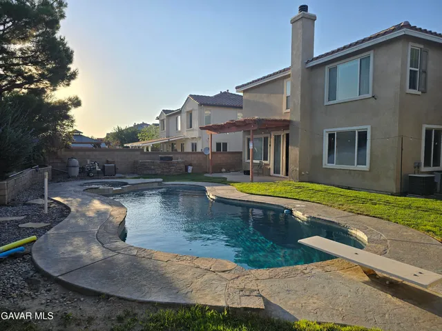 a view of a house with swimming pool
