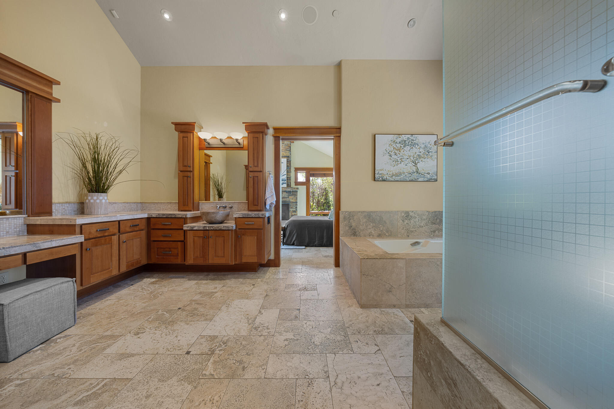 18883 Sutherland Court Bend, OR 97702 - Photo 27 of 70 A seamless blend of stone, light, and craftsmanship?luxury redefined in the home?s spa-inspired bath suite.
