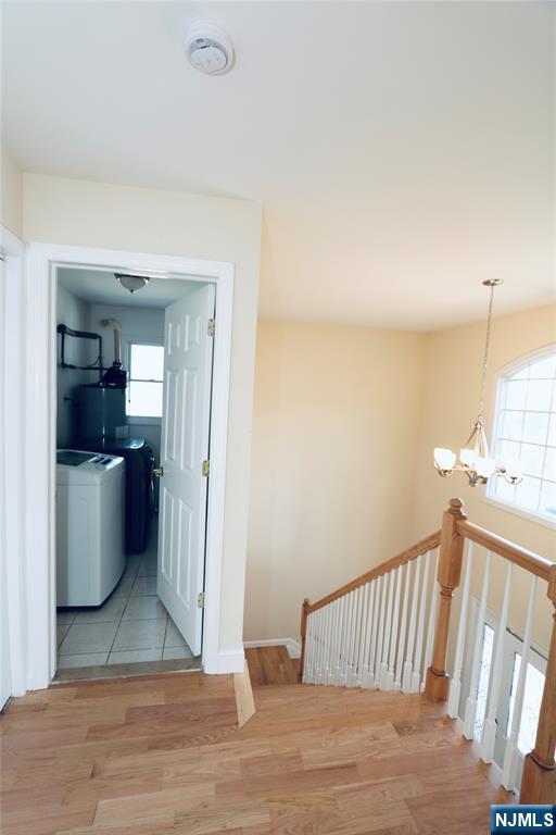 23 Main Avenue Wallington, NJ 07057 - Photo 29 of 29 a view of a hallway with wooden floor and staircase