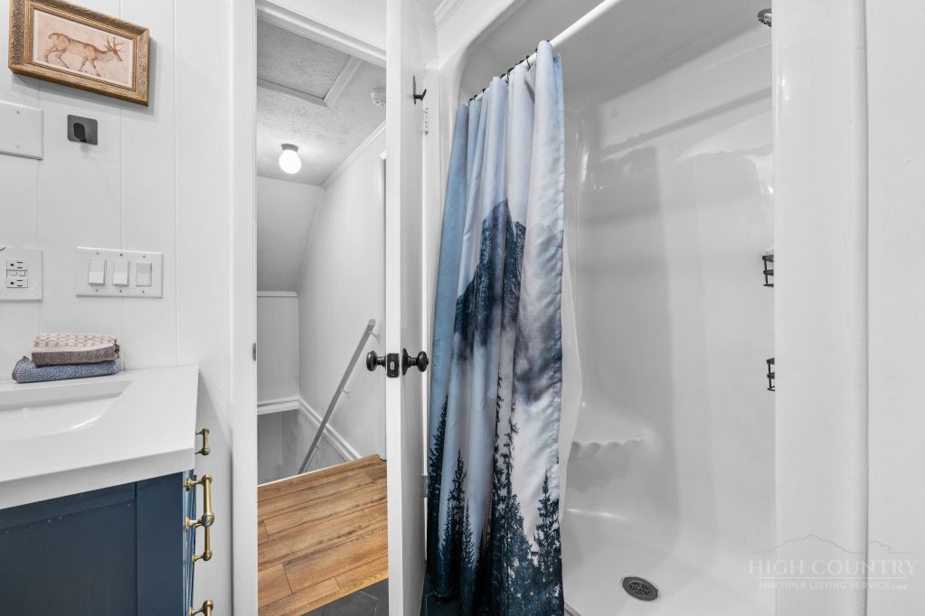 216 Saddle Lane Deep Gap, NC 28618 - Photo 20 of 44 a bathroom with a shower and a glass door