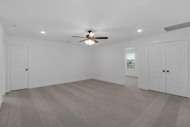 a view of gallery with wooden floor