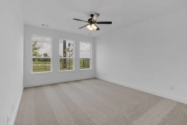 a bathroom with a tub sink double vanity granite tub shower and mirror