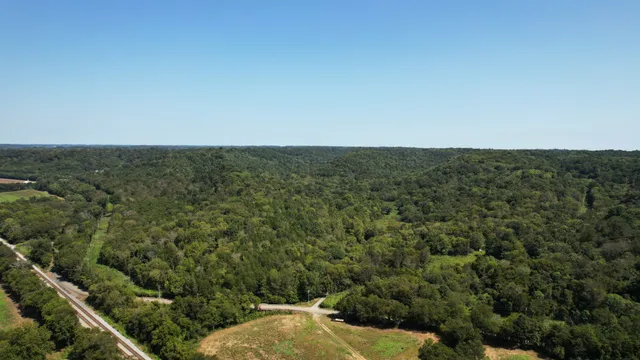 an aerial view of house with yard
