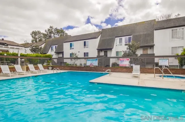 a view of a house with dining room and kitchen